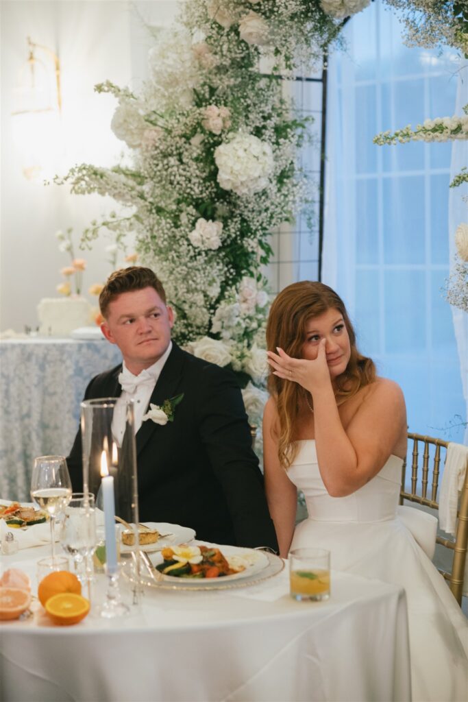 bride emotional at her wedding reception