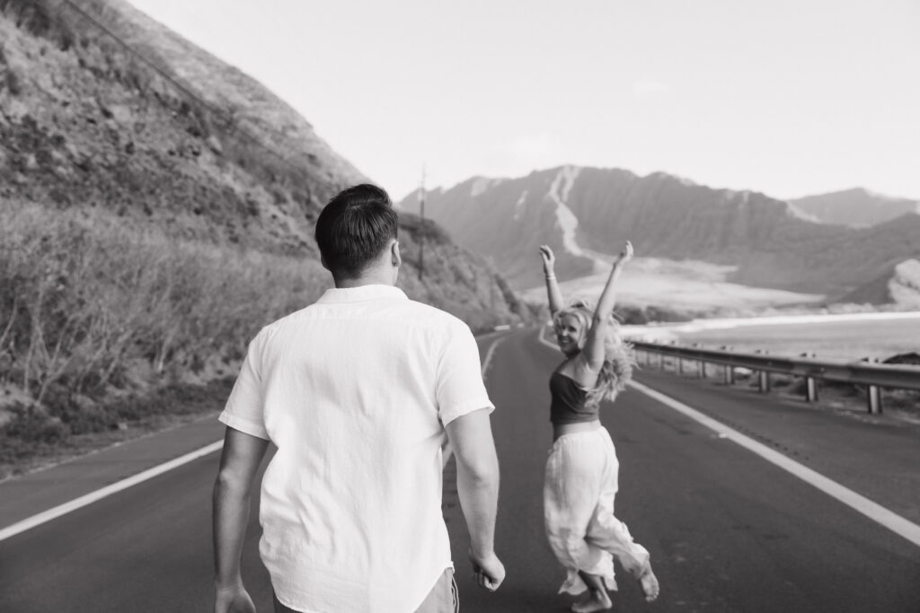 carefree couple running on a road 