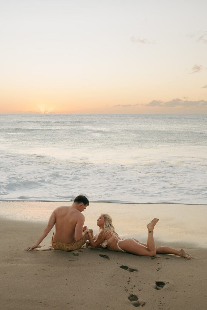 sunset couple in swim suits