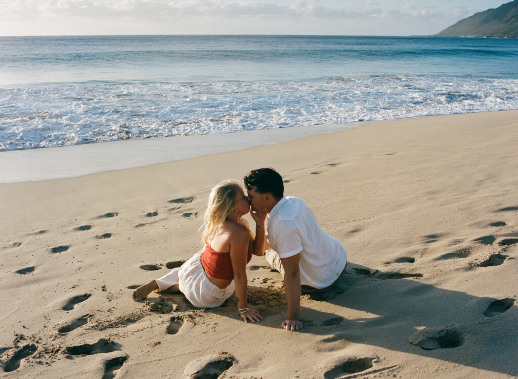 couple kissing at the beach on film