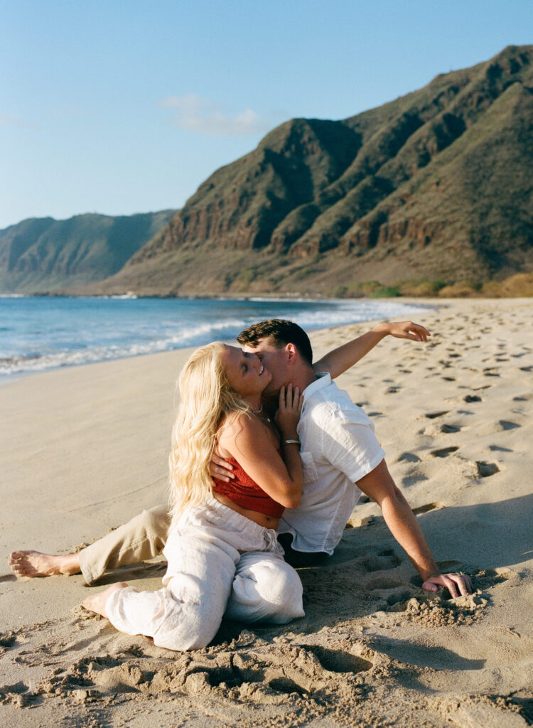 couple on the beach kissing 