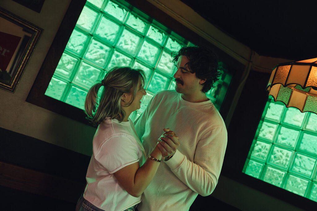 cute couple dancing in a bar 