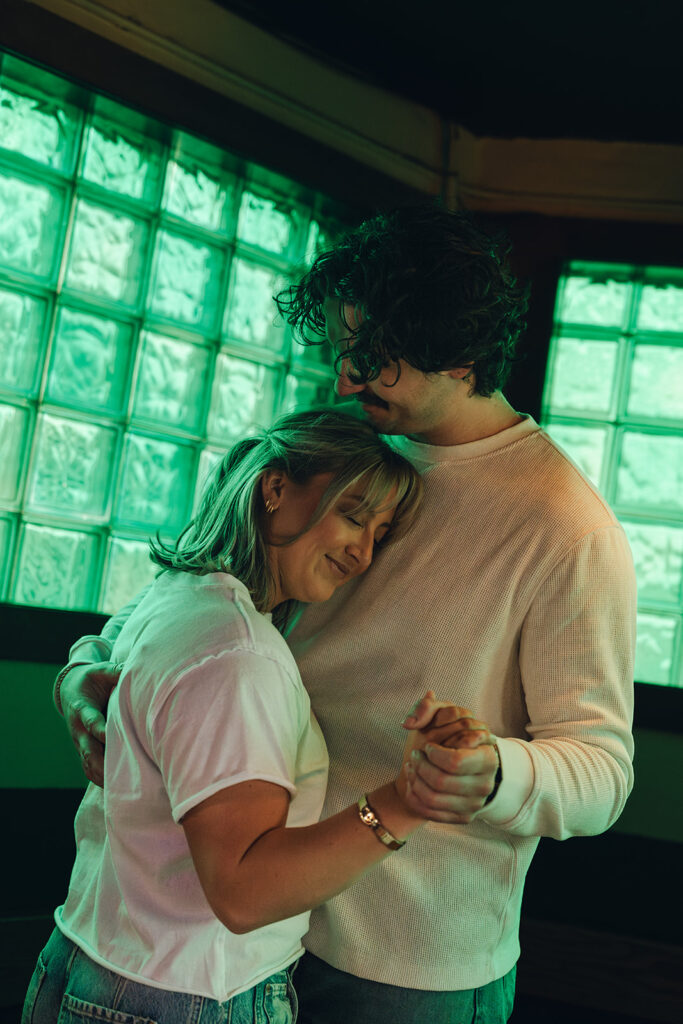 romantic couple dancing at a bar 