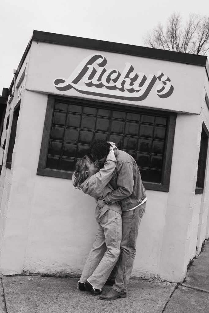 couple kissing in fron of Lukcy's 3 Star Bar