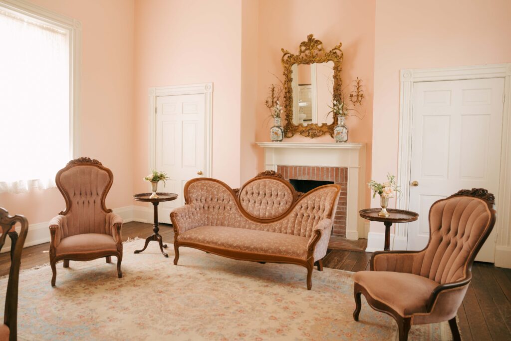Pink getting ready space at a Nashville wedding venue with pink accents, furniture and decorations.
