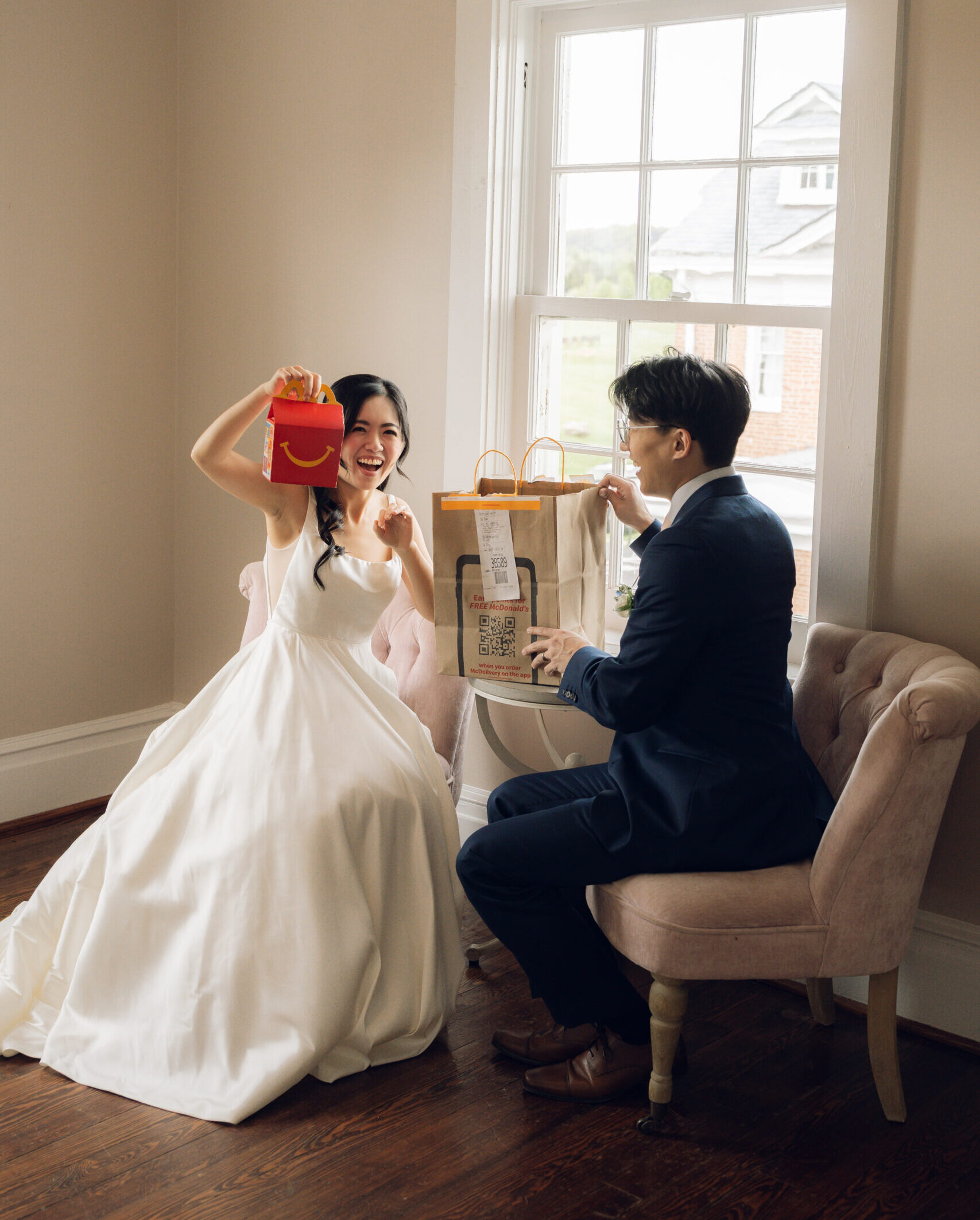 Bride and groom eating McDonalds laughing right before their ceremony at their wedding in Virginia. 