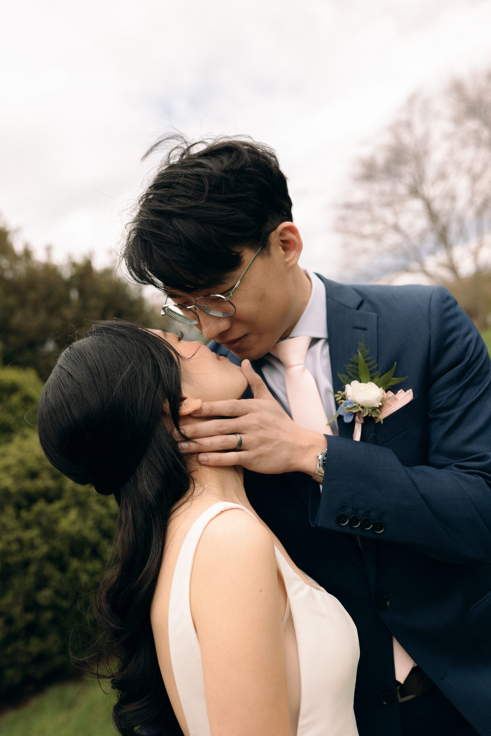 Bride and groom kissing outside of a wedding venue in virginia