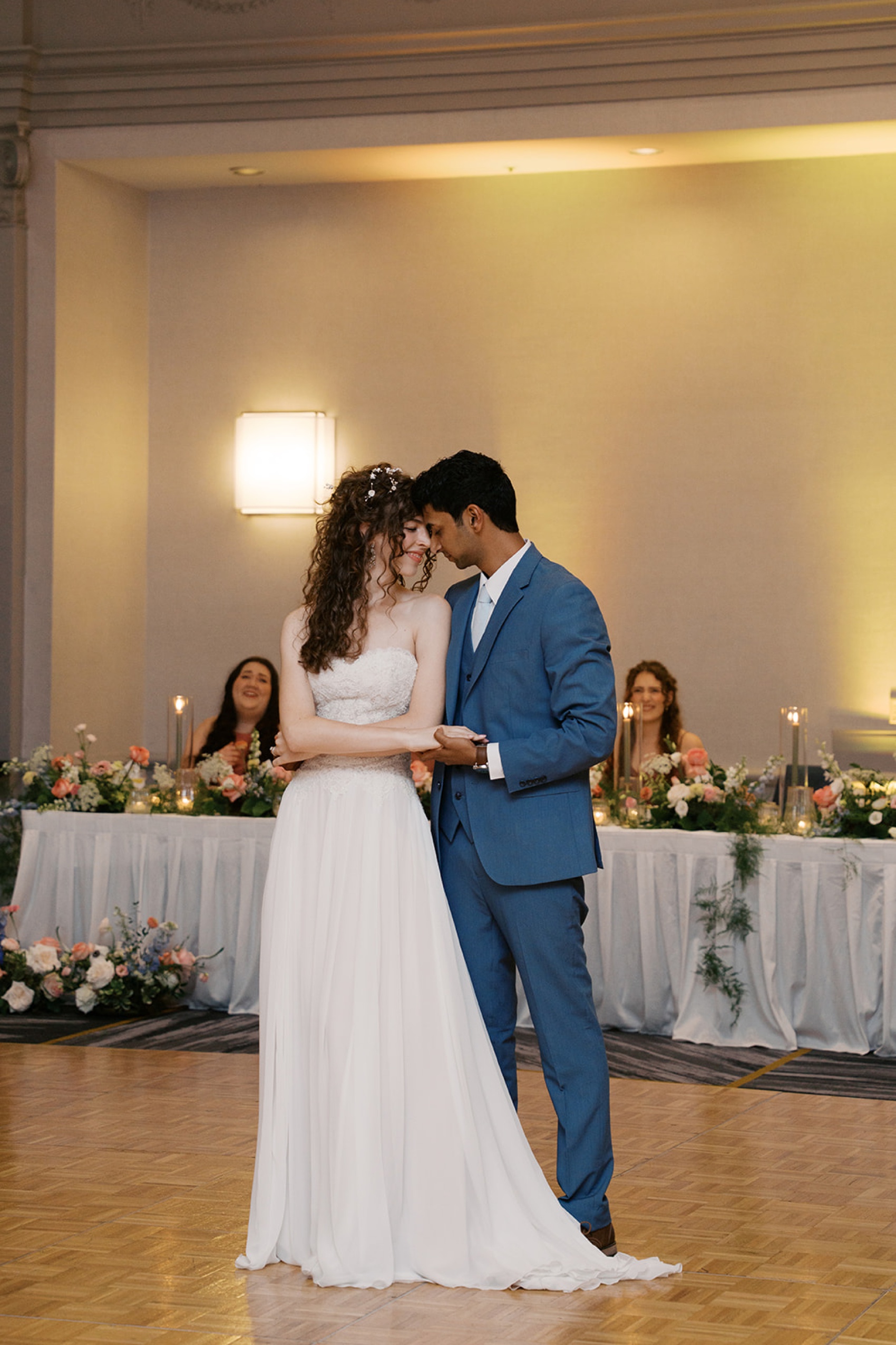 Newlyweds touch foreheads during a first dance at their vine street christian church wedding