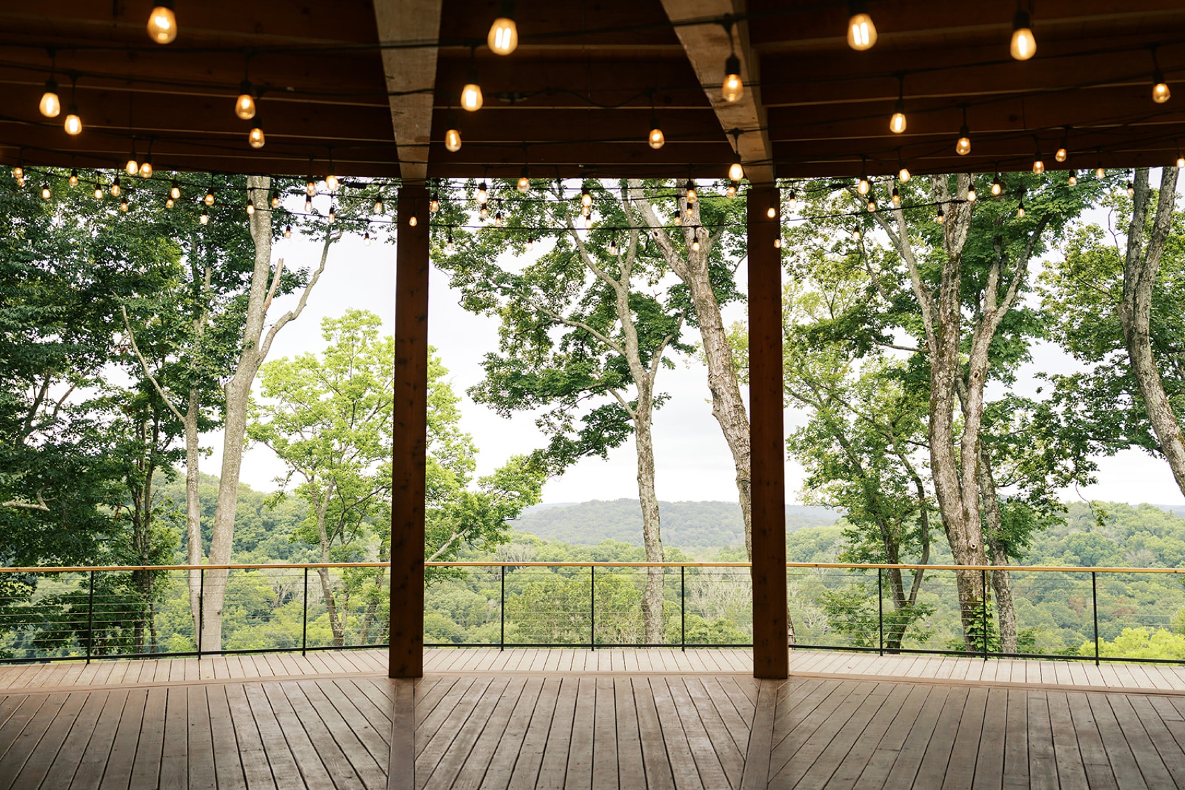 A peak of the view from the covered deck overlooking the hills behind the southall farm and inn wedding venue