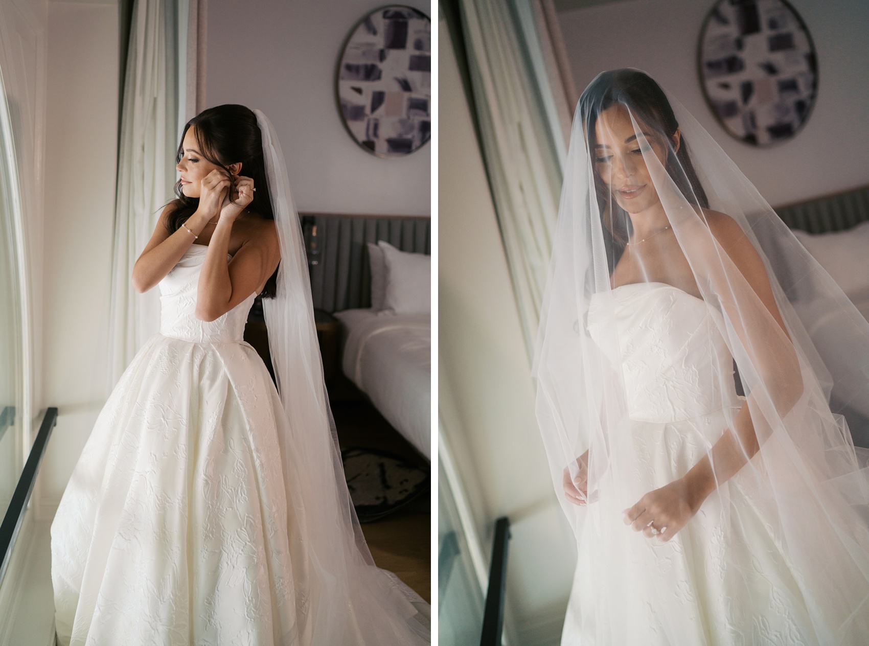 A bride get ready in a window putting earrings on next to her under her veil