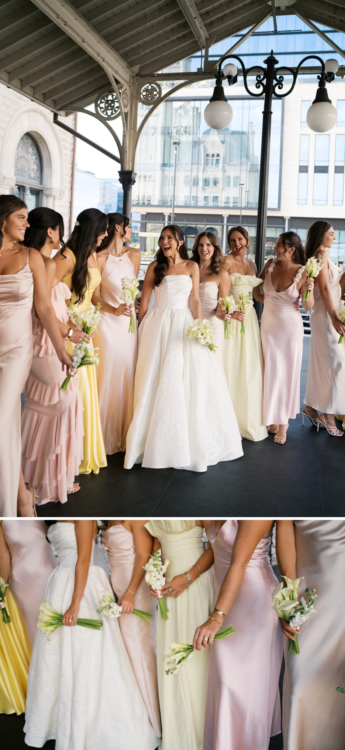 A bride laughs with her bridesmaids under a station canopy in pink and yellow at her union station wedding in nashville