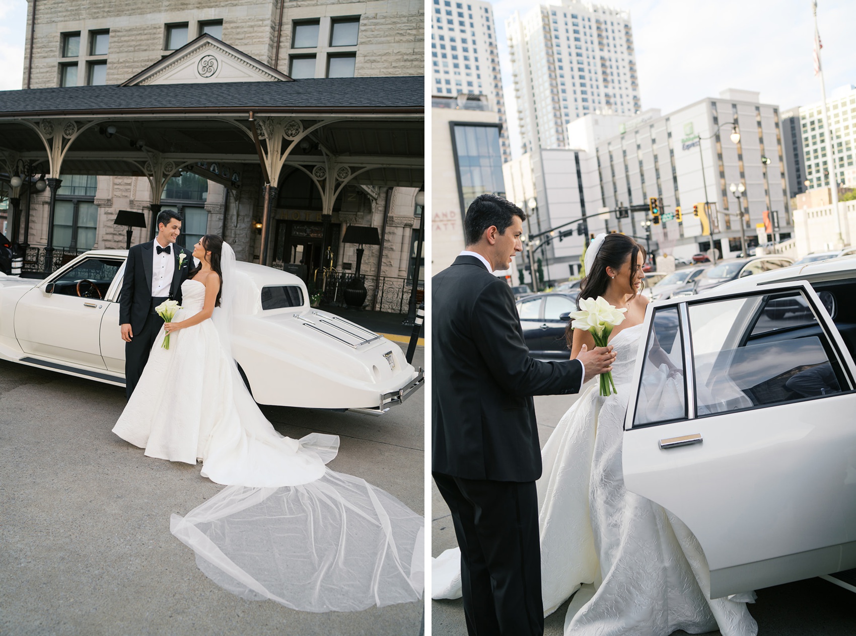 A groom helps his bride into a vintage white car in downtown next to them leaning on the car at venue