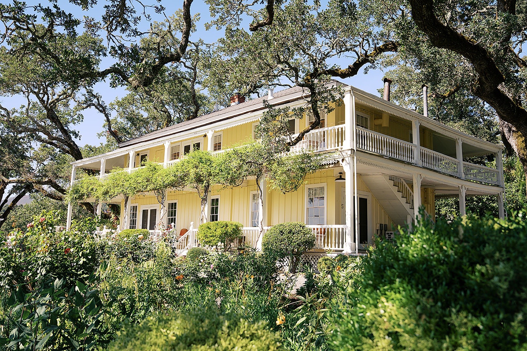 Details of the back porches of the beltane ranch wedding venue hiding under oak trees and vines