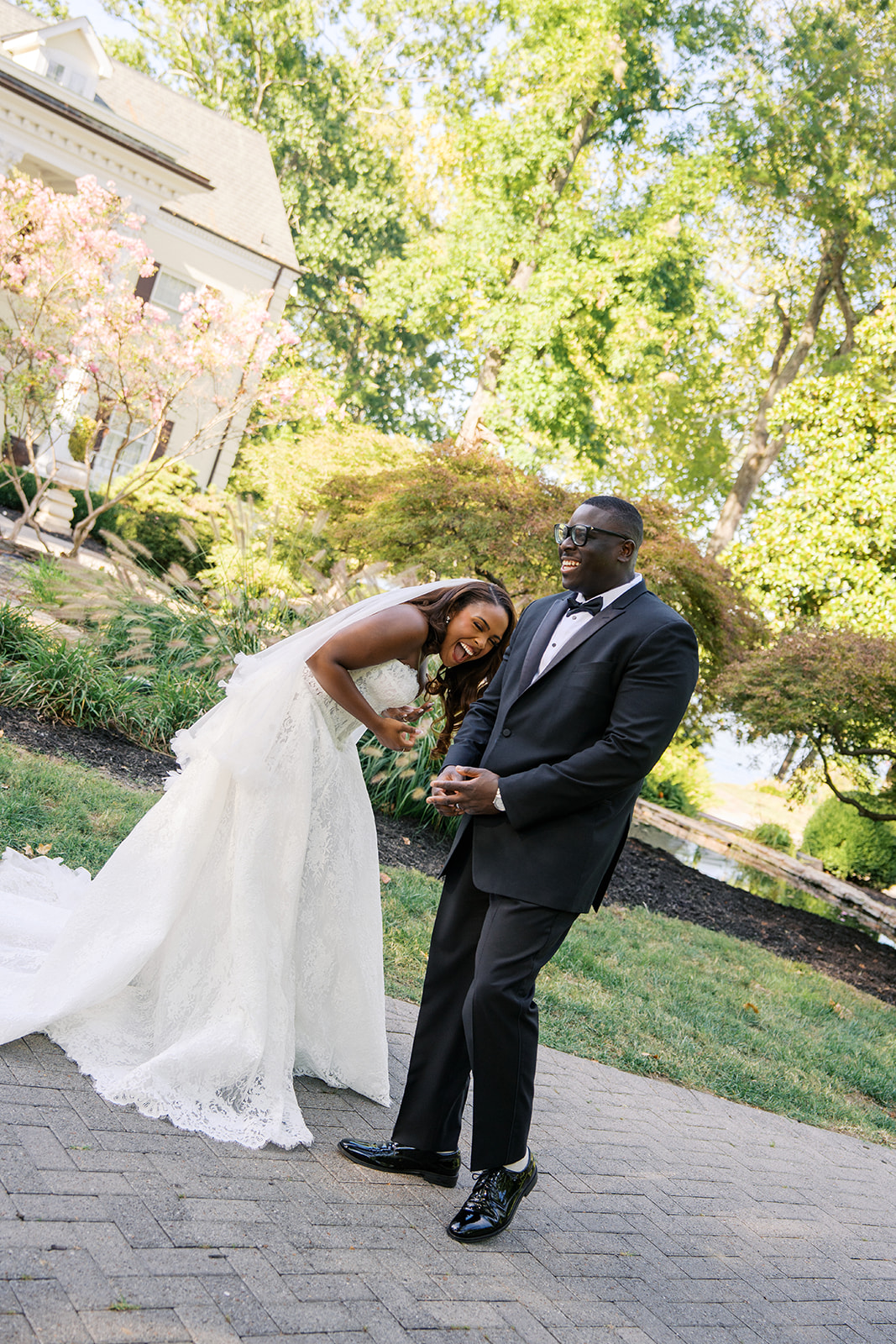 A couple during their wedding laughing hard at the camera in lebanon tennessee. taken by nashville best wedding photographer jaimee raneigh photography. 