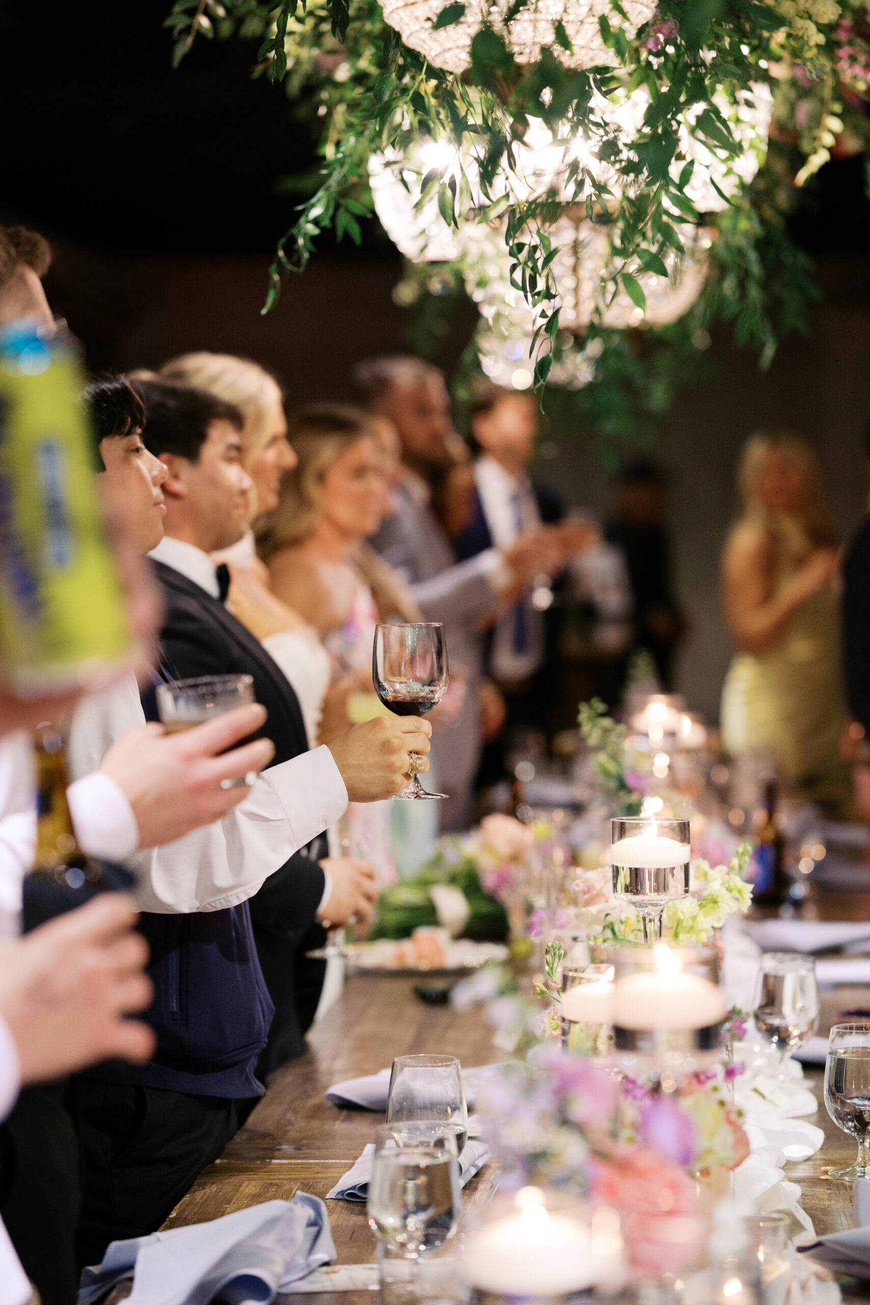 Guests hold up glasses to cheers at mint springs farm