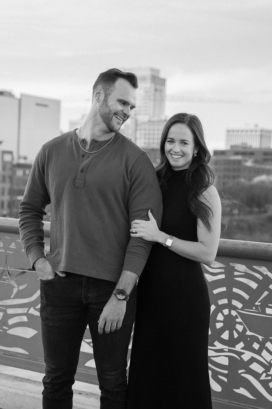a couple laughing looking at the camera after their proposal in nashville