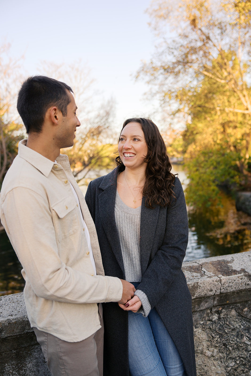 a couple holding hands at centennial park in nashville tennessee after their proposal