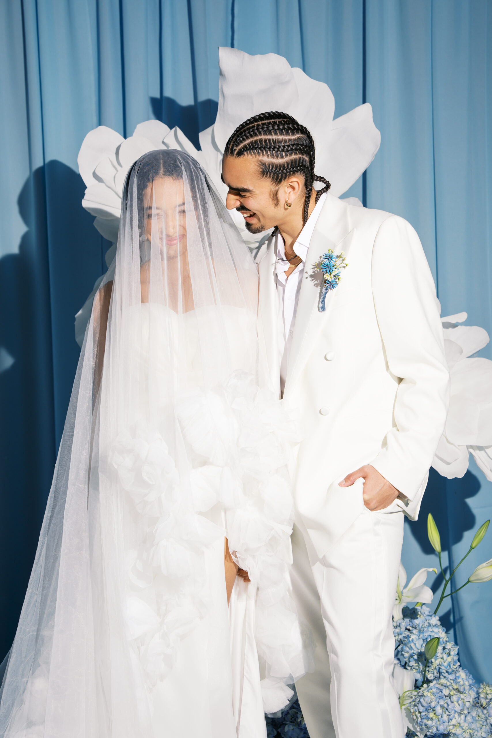 a flash photo of a bride and groom in all while laughing during their wedding at diamond creek farms