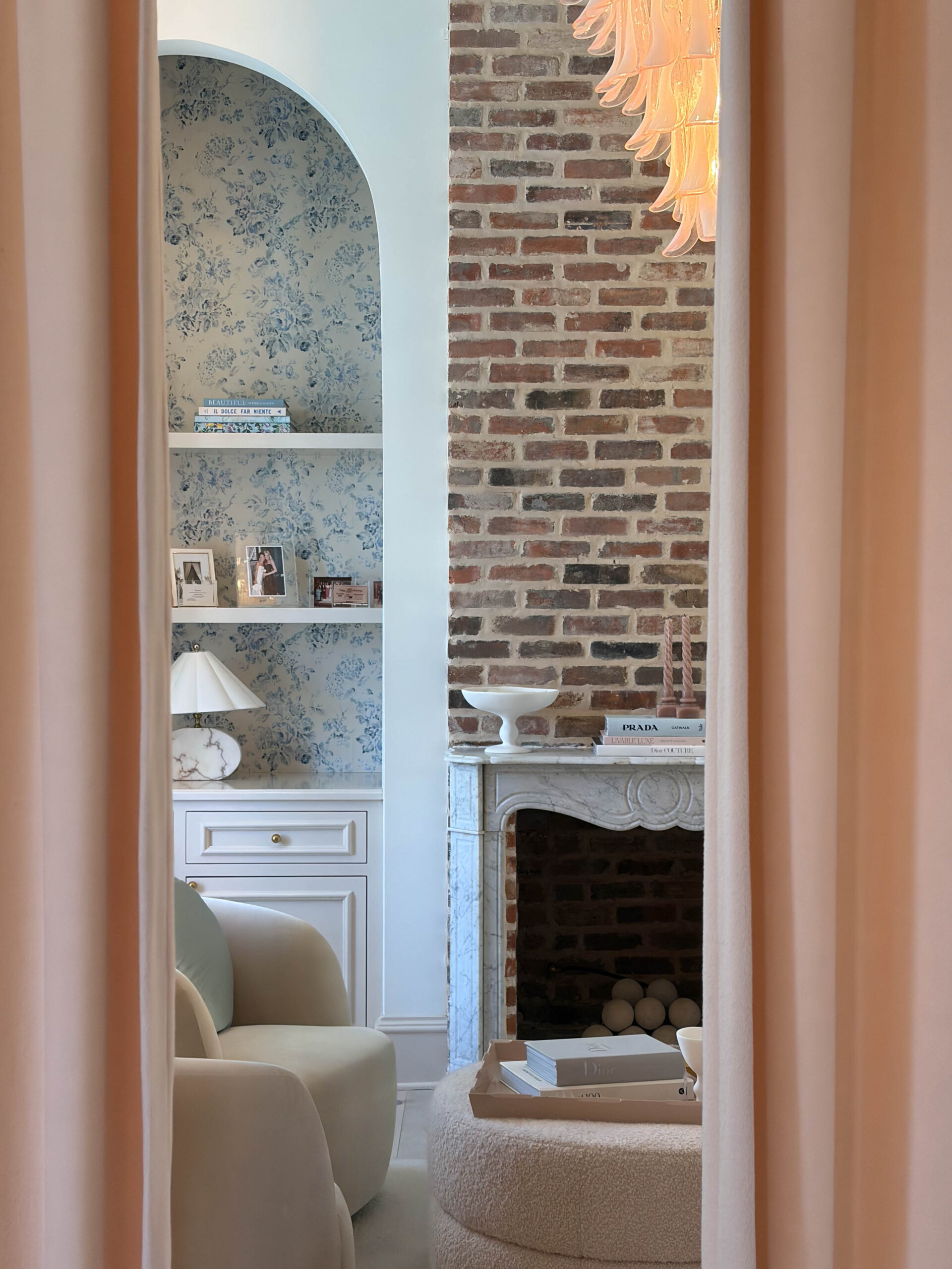 a photo of a getting ready space at The Sloane wedding venue in Nashville with pink curtains and a brick wall.