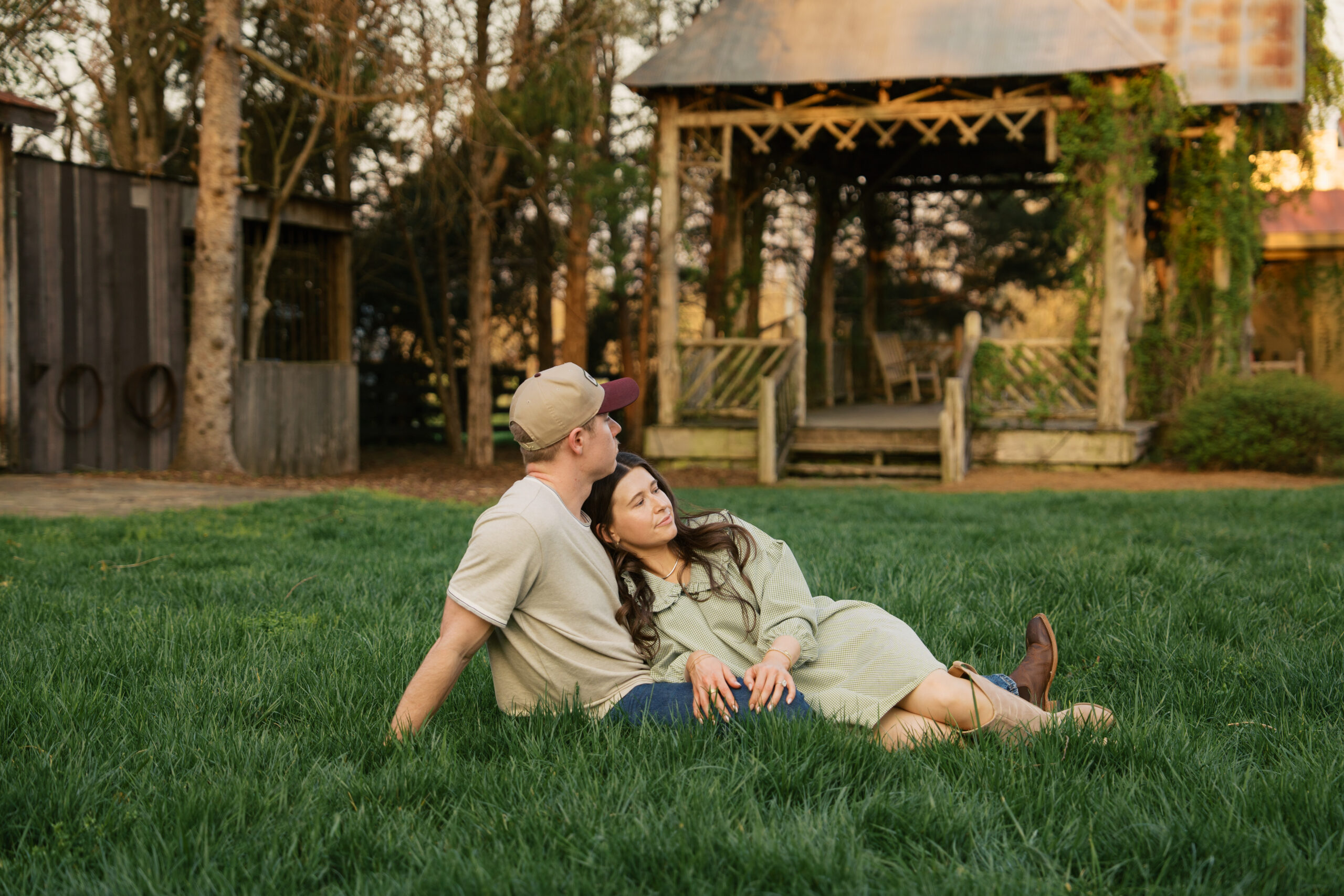 couple laying in the grass during their engagement session in Tennessee