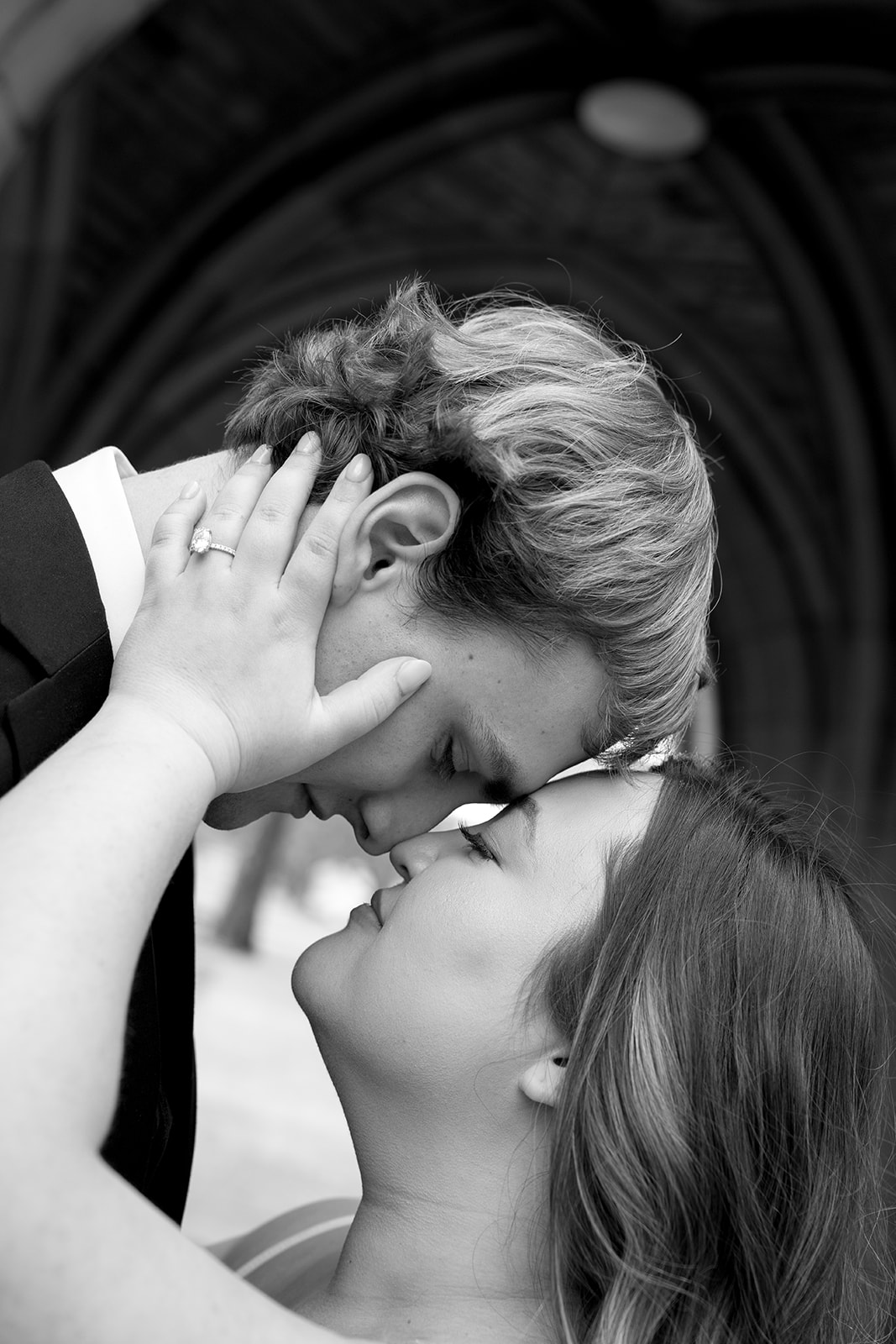 A bride puts her hands on the grooms face with their foreheads together at their wedding in nashville tennessee
