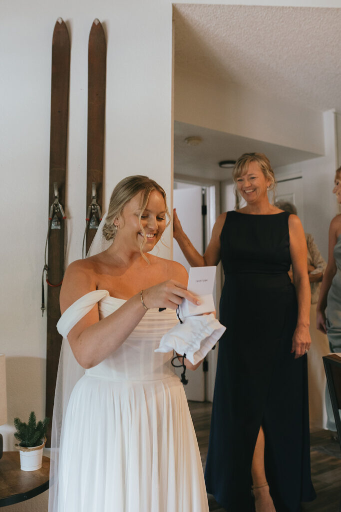 bride opening her wedding gift 