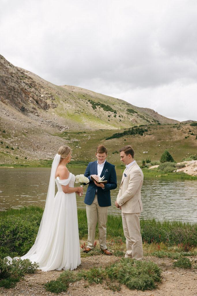 bride and groom holding hands during their intimate elopement ceremony