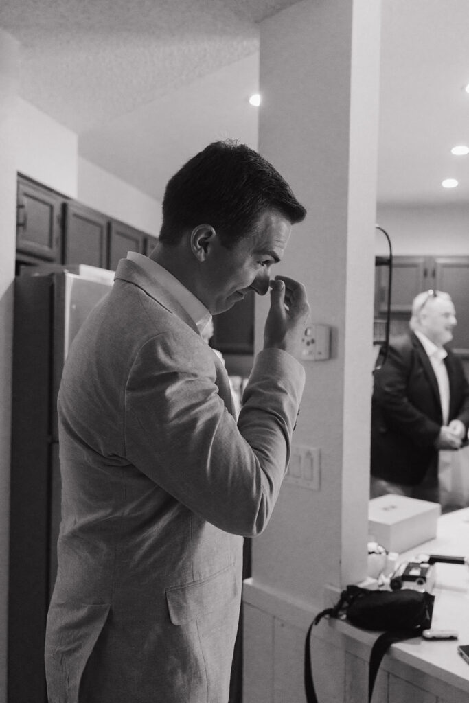 groom emotional seeing the bride in her wedding dress