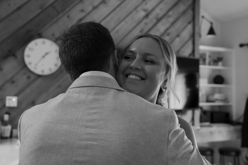 bride and groom hugging