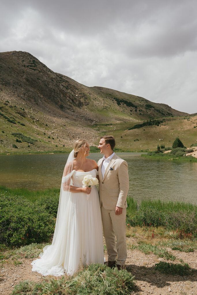 bride and groom looking at each other 