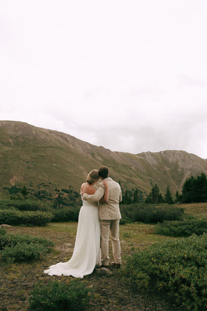 bride and groom hugging