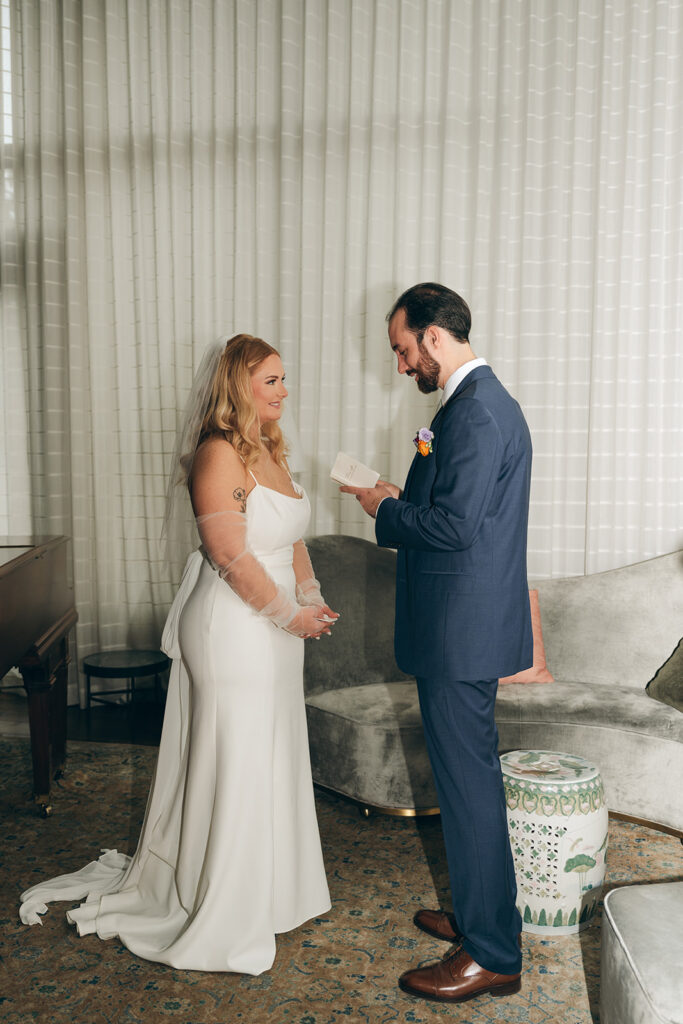 bride and groom reading their wedding vows