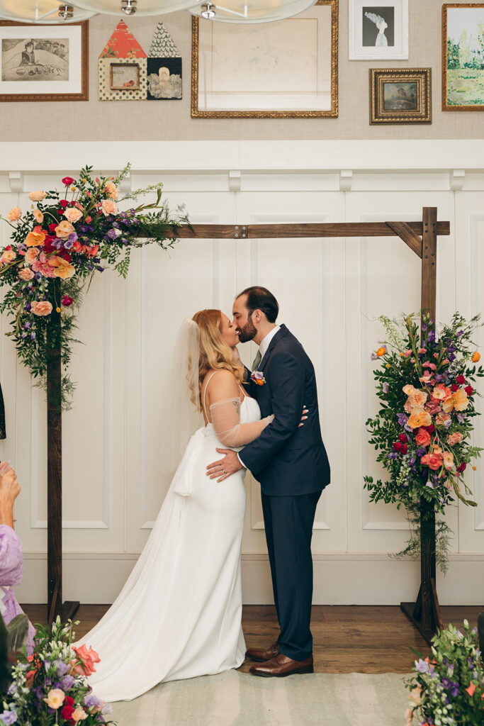 bride and groom kissing after their wedding ceremony 