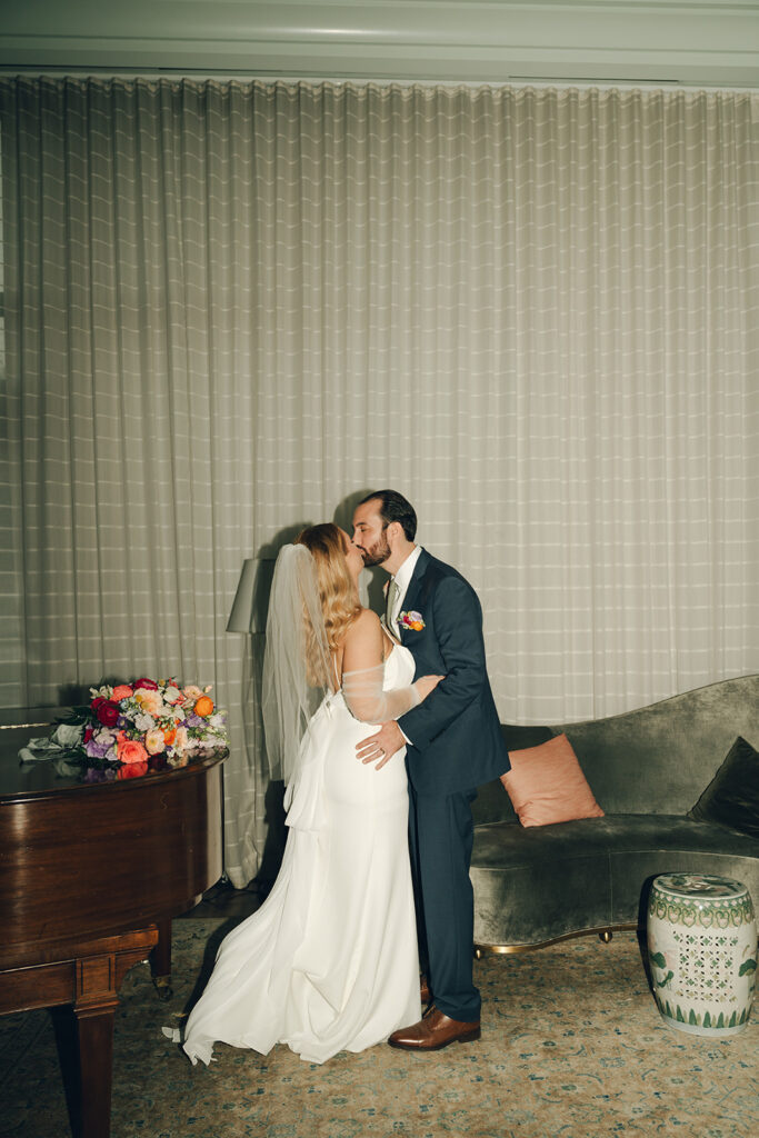 portrait of the bride and groom kissing 