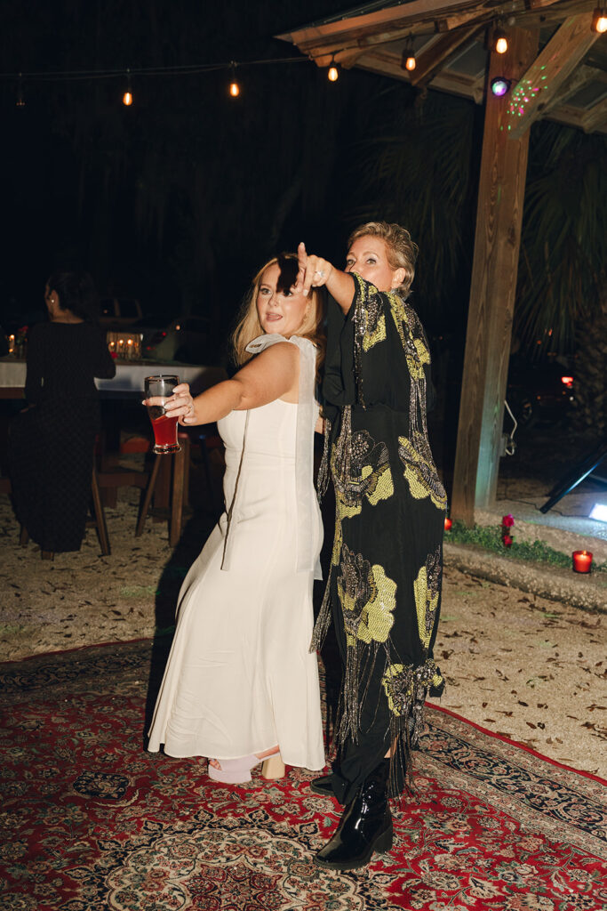 bride and her mom dancing