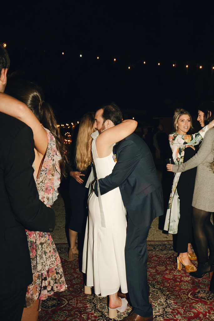 bride and groom hugging