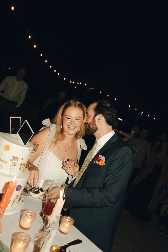 groom kissing the bride on the cheek