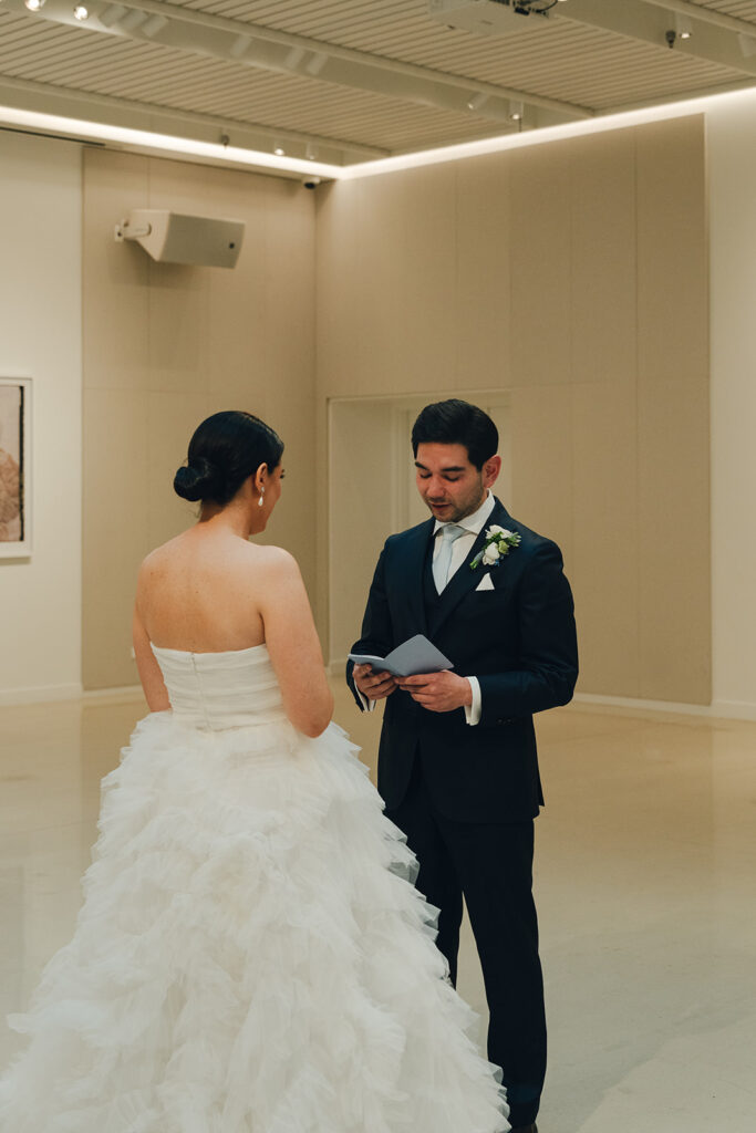 bride and groom reading their vows- customer experince