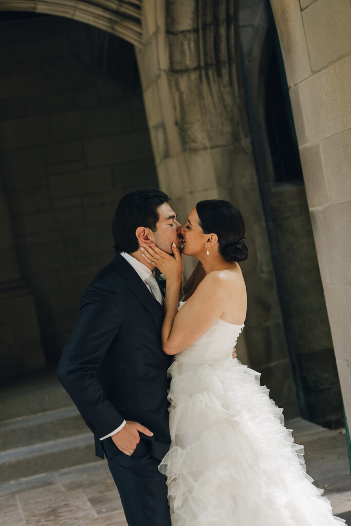 bride and groom kissing after their wedding ceremony 