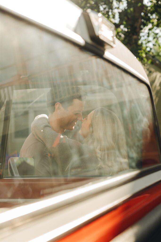 newly engaged couple looking at each other 