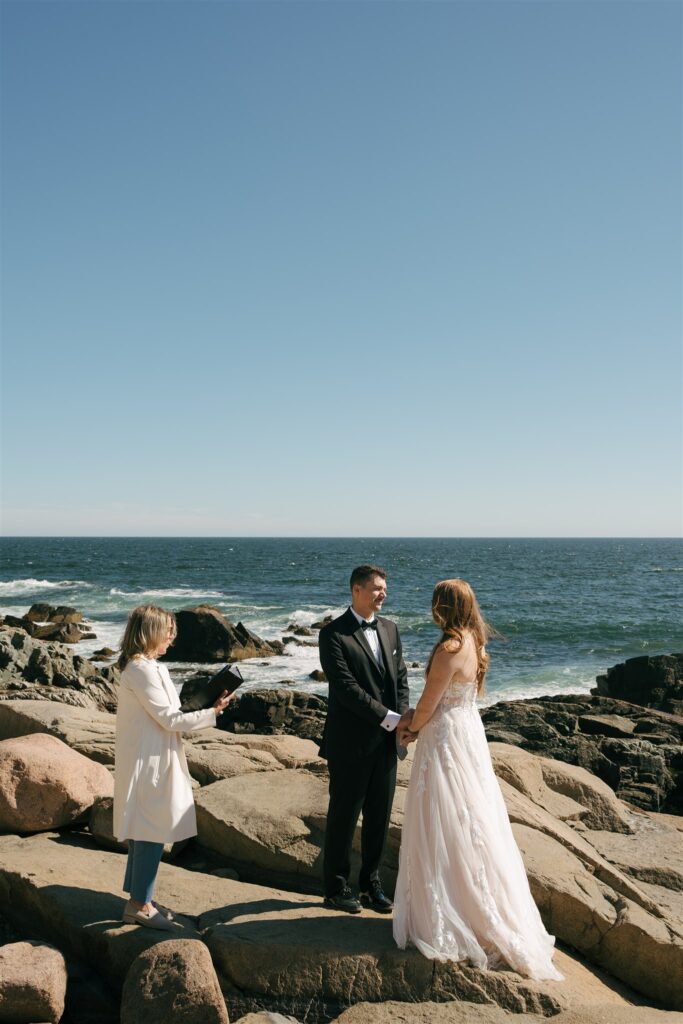 bride and groom holding hands during their elopement ceremony