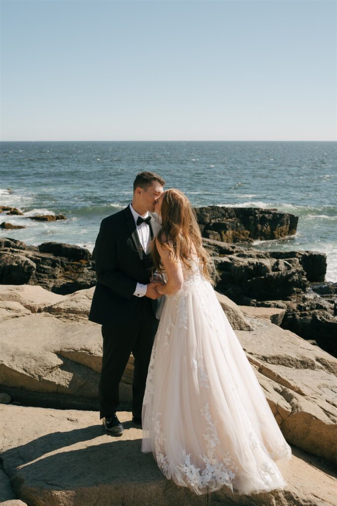 bride and groom kissing after their wedding ceremony 