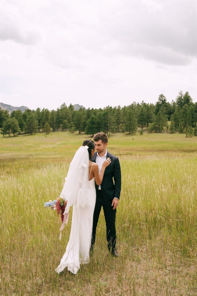 bride and groom hugging during their photoshoot