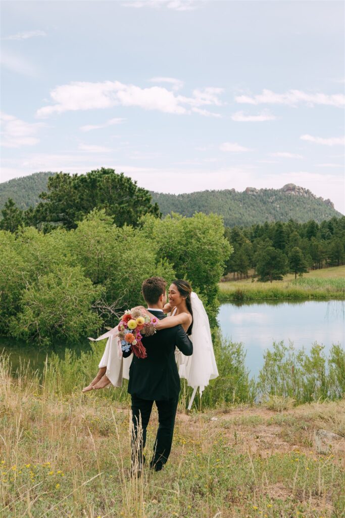 groom carrying their bride during their photoshoot