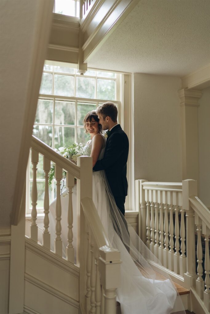 groom hugging the bride