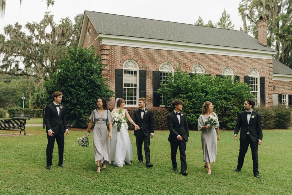 bride and groom heading to their wedding reception with their friends