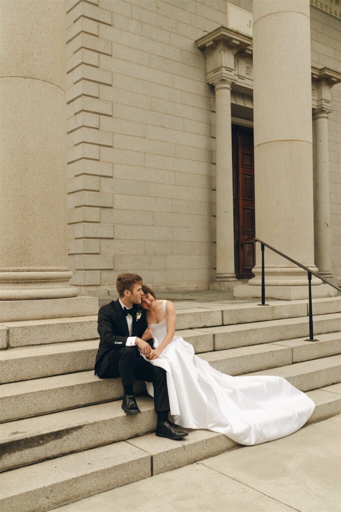 bride resting her head on the grooms shoulder 