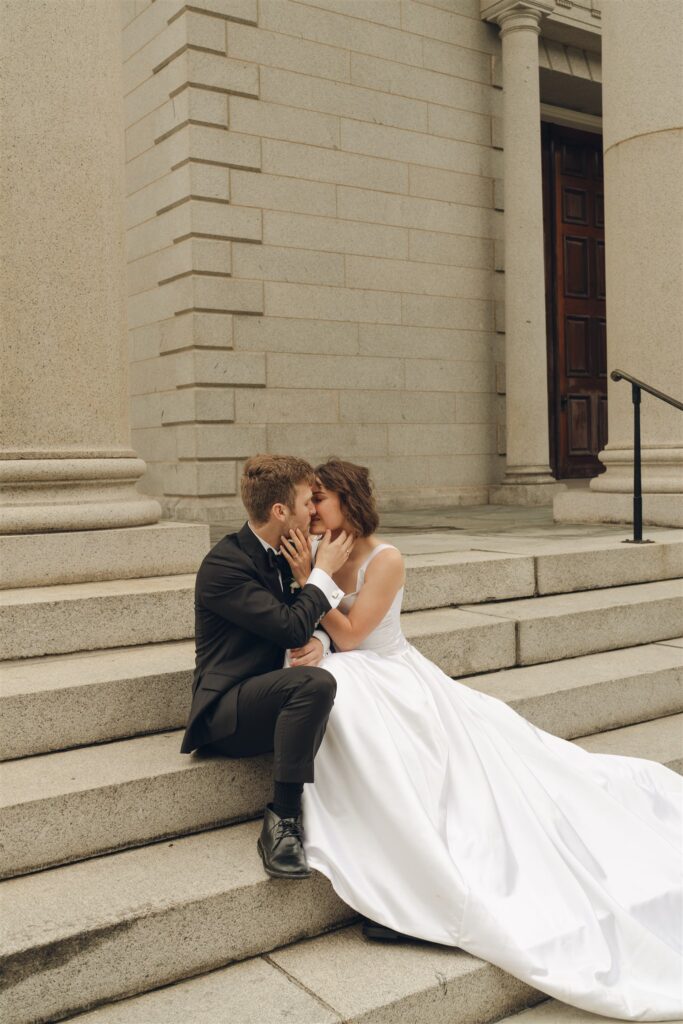 newly married couple kissing 