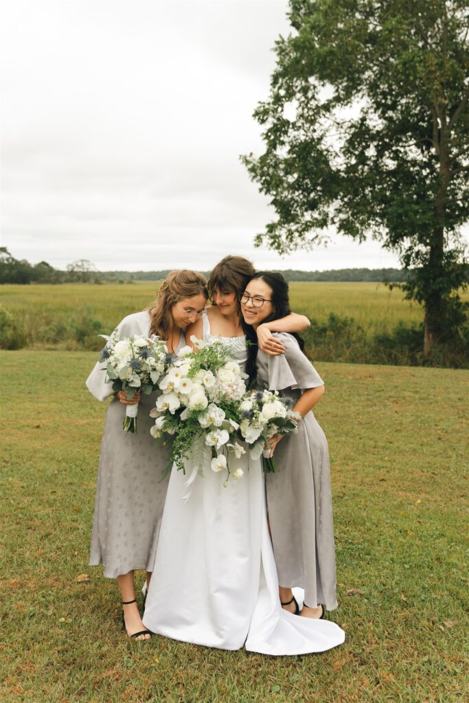 bride and her friends hugging 