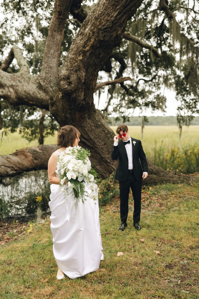 groom looking at the bride